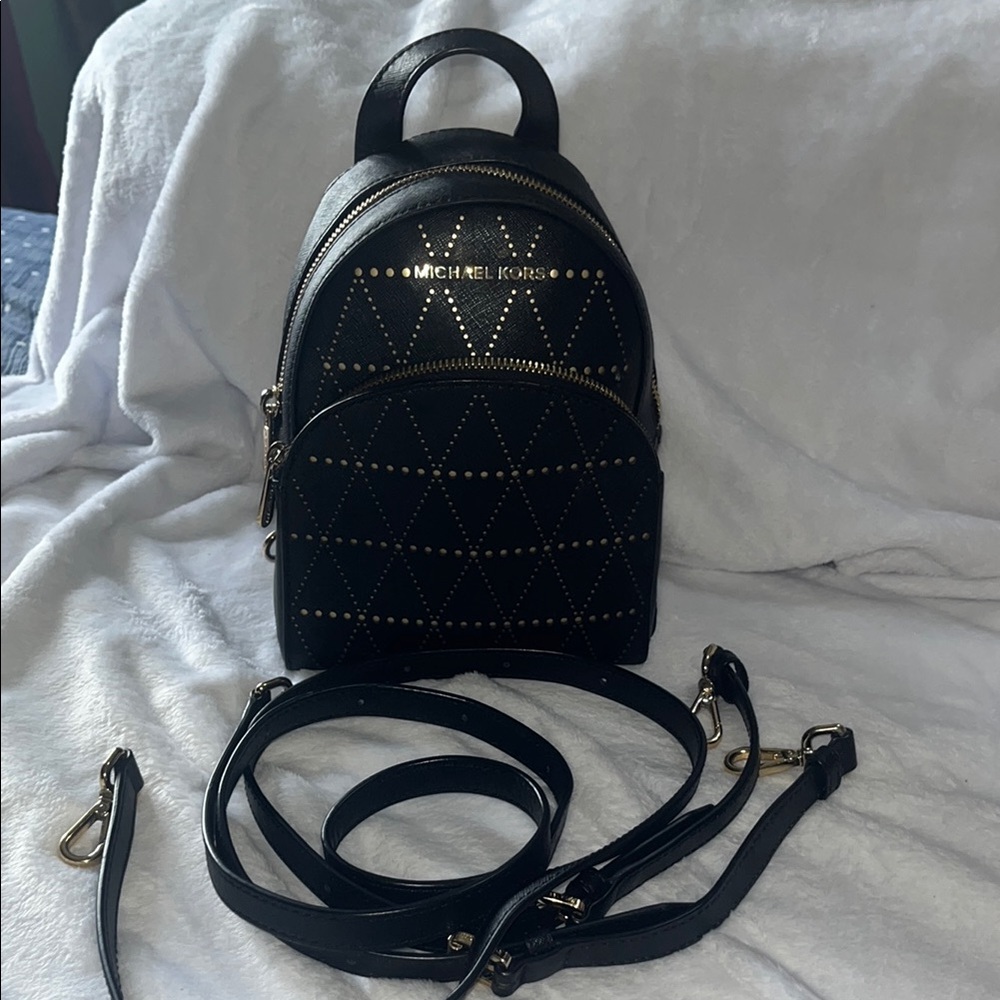 Michael Kors Black Mini Backpack with Adjustable Straps and Geometric Design
